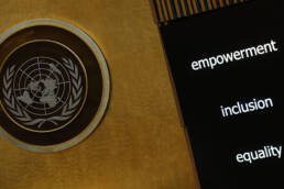 The Un emblem is hanging next to a monitor which reads 